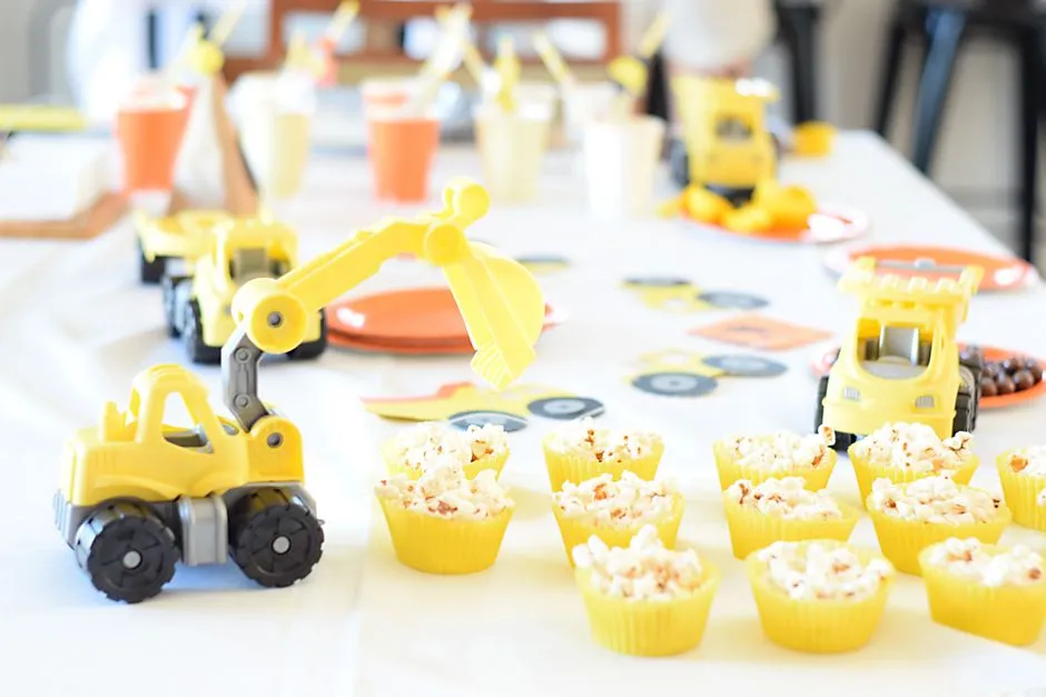 A table set with snacks and treats for a kids' birthday party